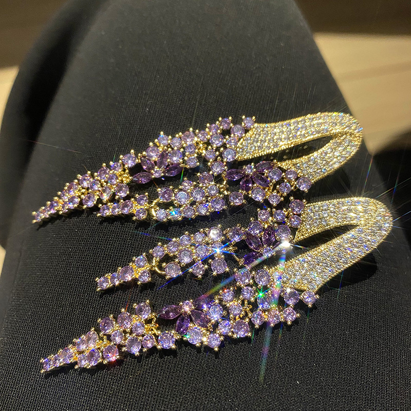 Aretes colgantes de flecos de circonita bañados en oro